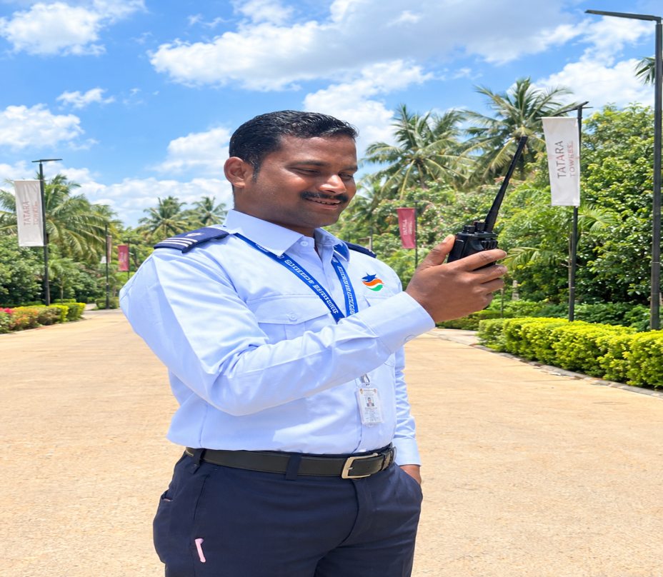 DB Security Services guard on duty with a walkie-talkie