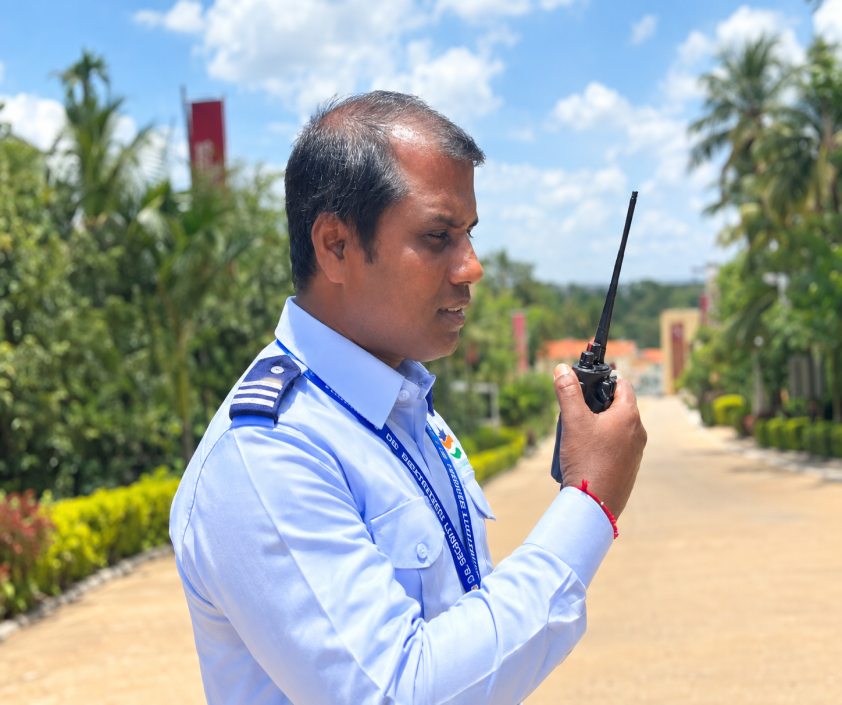 Guard coordinating with the team over a walkie-talkie